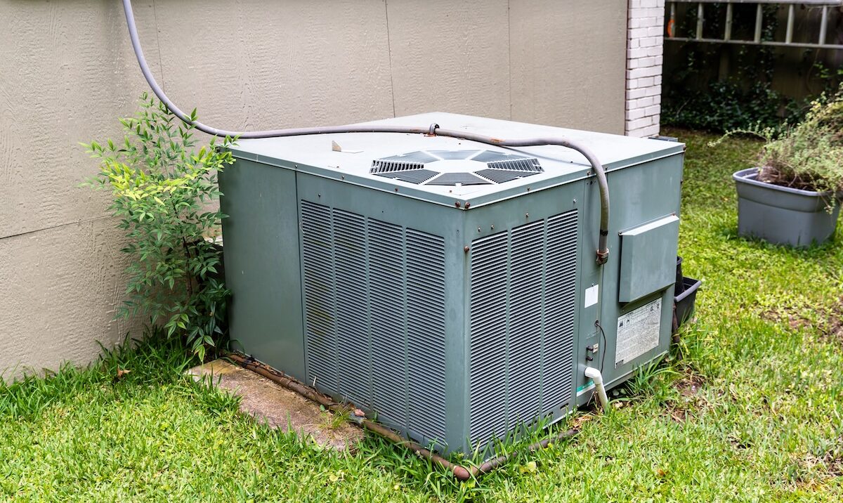 Package Air Conditioner system next to a home.