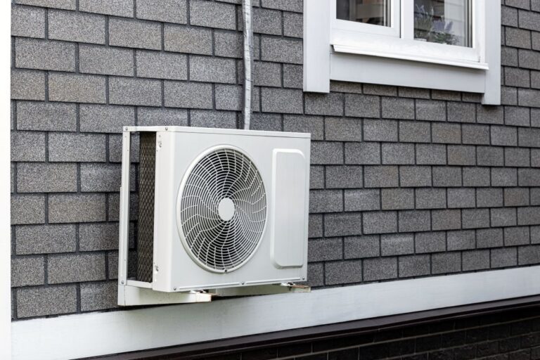 the external unit of the air conditioner is attached to the wall of the house